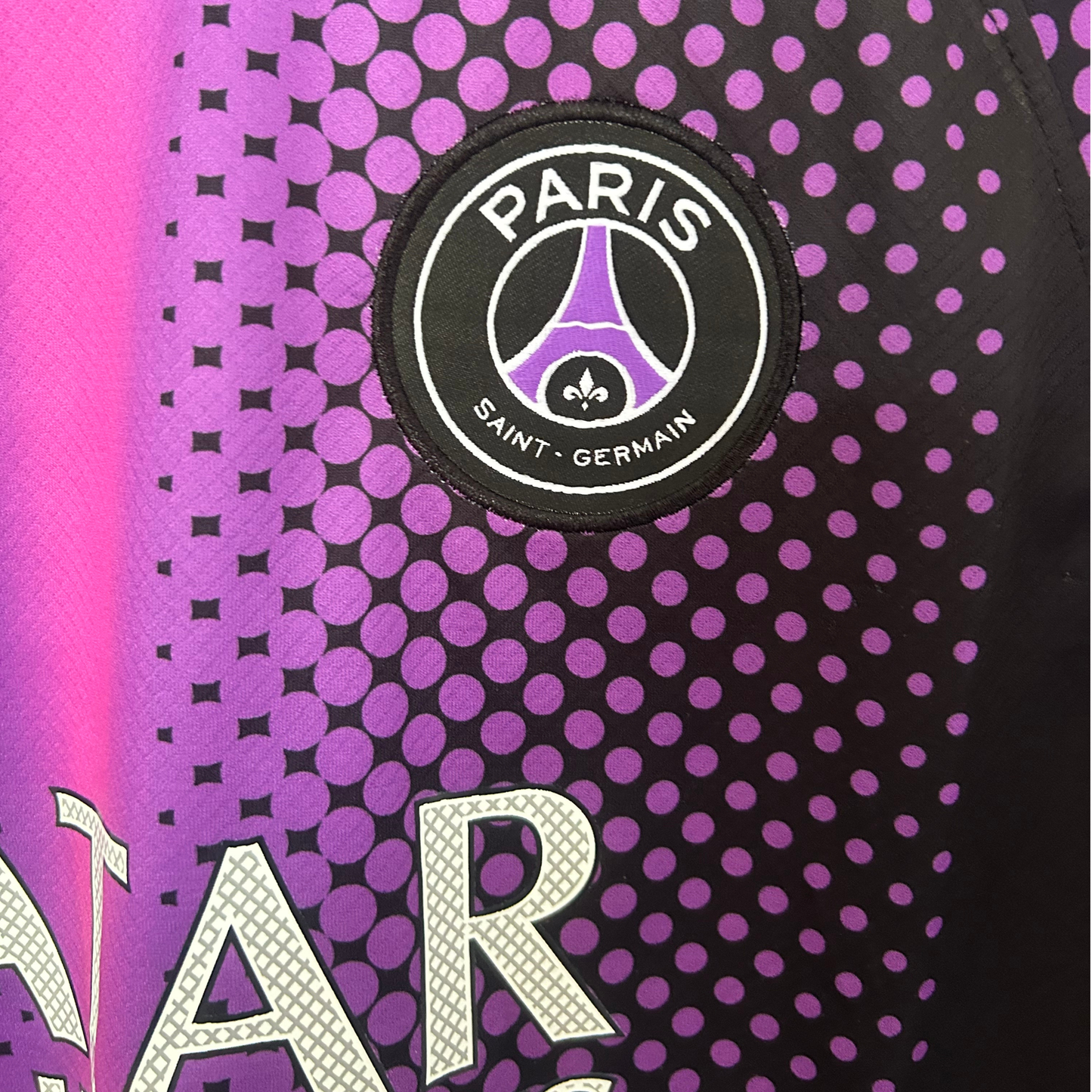 ELVN PSG x Jordan pre-match kit featuring a navy blue jersey with red and white accents and matching shorts, designed for football fans.
