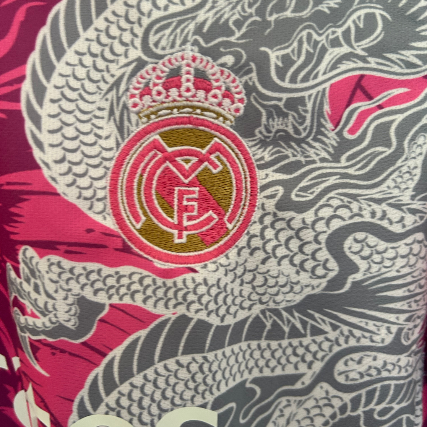 Real Madrid Rose Dragon football kit by ELVN featuring the team jersey with rose and dragon design on a white background.