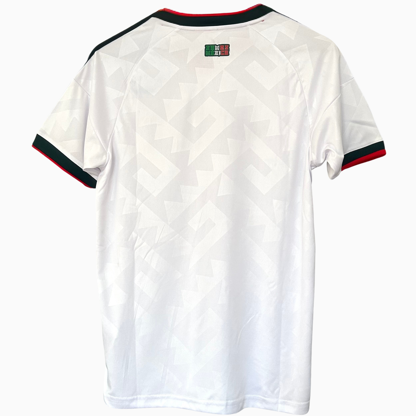 Elvn Mexico Away Kit 2026 jersey displayed on a hanger with the team logo and vibrant red and black design details.