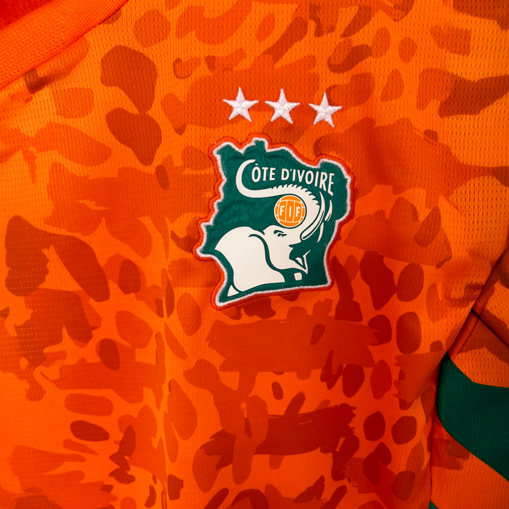 IVORY COAST Home Kit 2026 soccer jersey by ELVN, featuring white and green design with team logo and sponsor details.