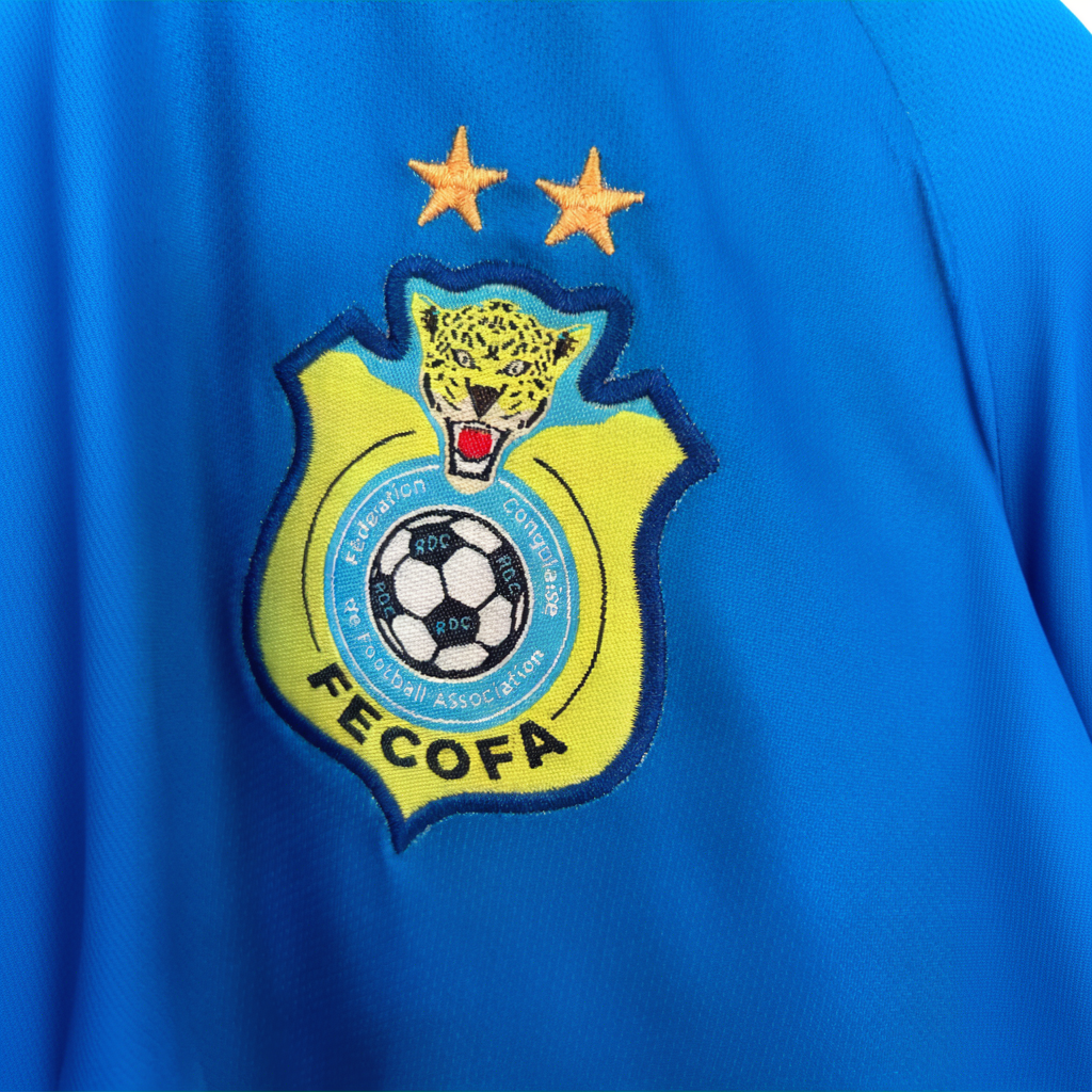 ELVN DR Congo home kit 2026 jersey featuring team logo and vibrant green and yellow design, displayed on a mannequin.