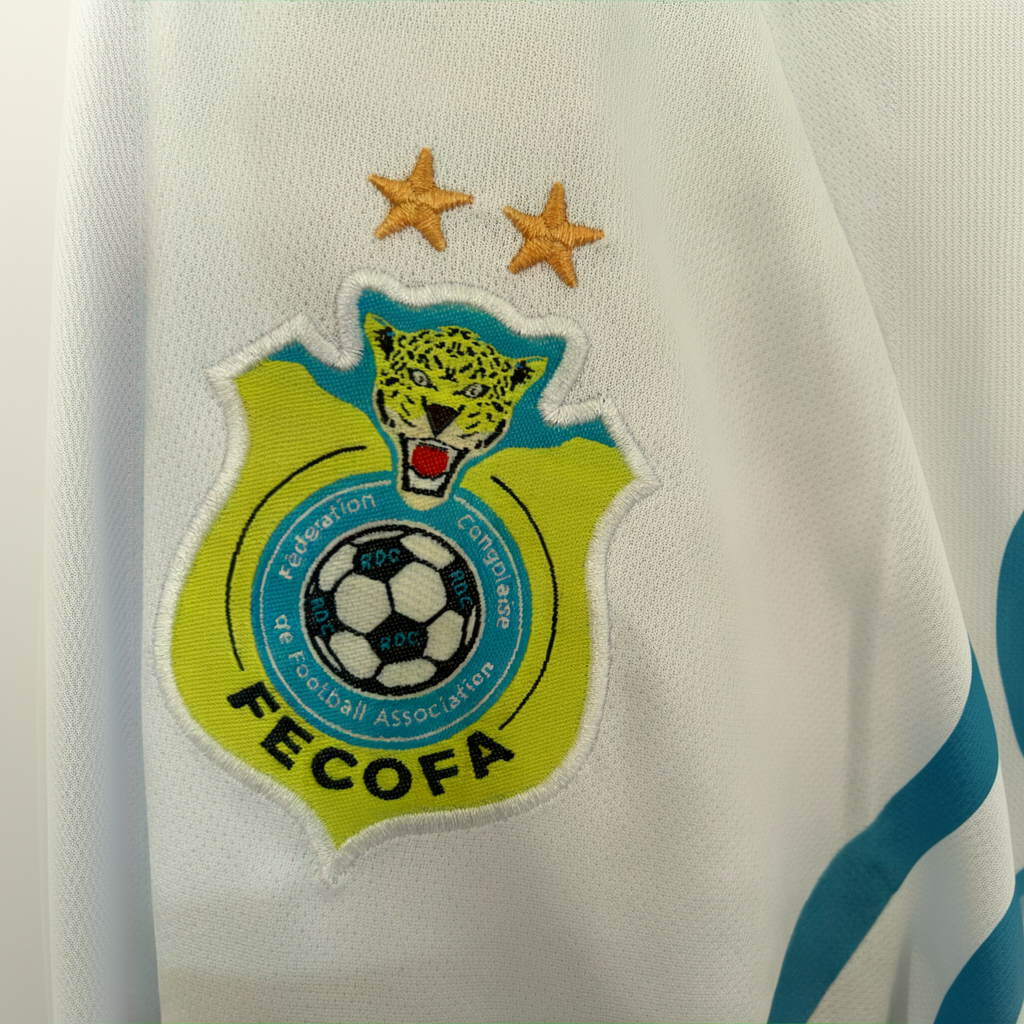 ELVN DR Congo away kit 2026 jersey featuring team logo, blue and red design, and athletic fit, displayed on a plain background.