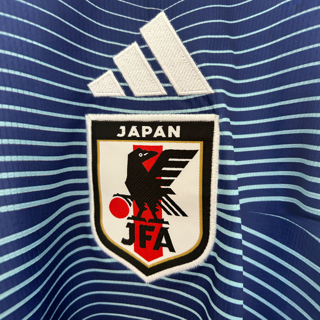 Japan Home Kit 2026 jersey by ELVN featuring team crest and red and white design, displayed on a plain background.