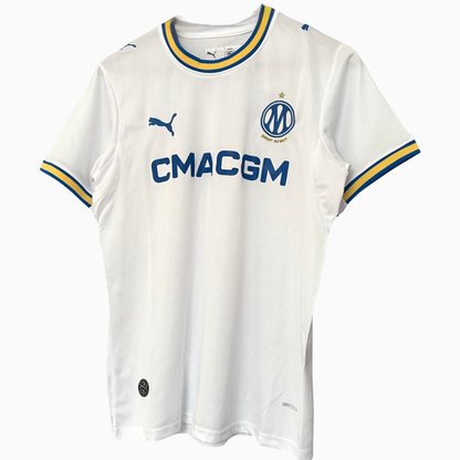 OLYMPIQUE MARSEILLE 2026/27 home kit by ELVN, featuring the team's jersey with club crest and team colors on a display.