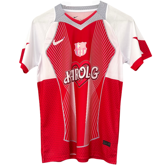 Red FC Barcelona x Karol G kit by ELVN, featuring team logo and vibrant design, displayed on a sports jersey.