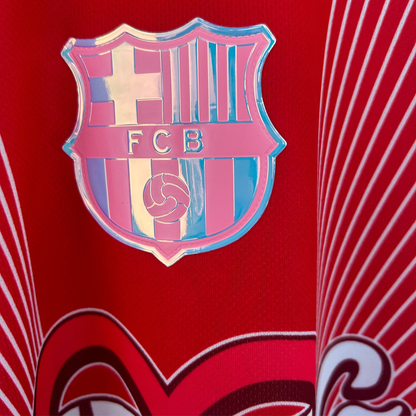 Red FC Barcelona x Karol G kit by ELVN, featuring team logo and stylish design, displayed on a mannequin.