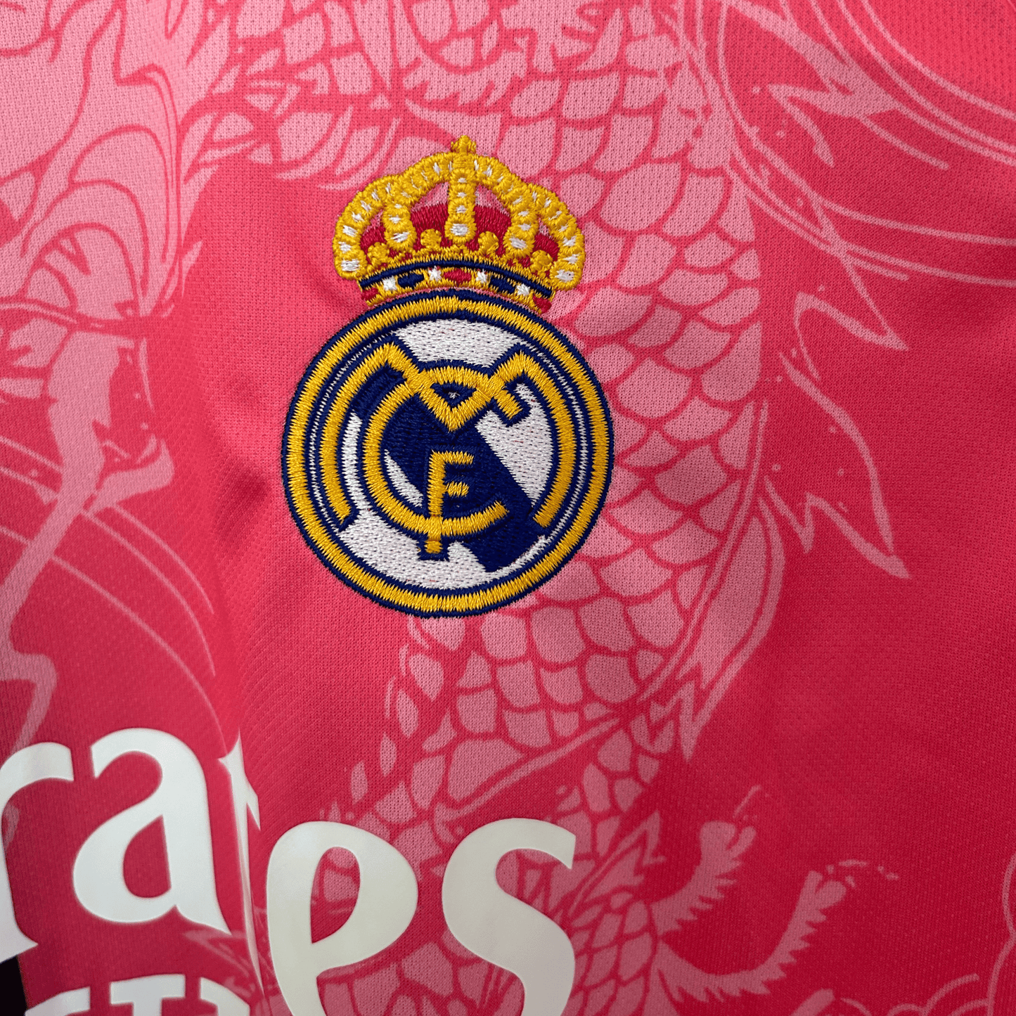 ELVN Real Madrid Dragon Rose Noir kit featuring black and pink sportswear with team logos and detailed design elements.