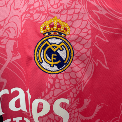 ELVN Real Madrid Dragon Rose Noir kit featuring black and pink sportswear with team logos and detailed design elements.