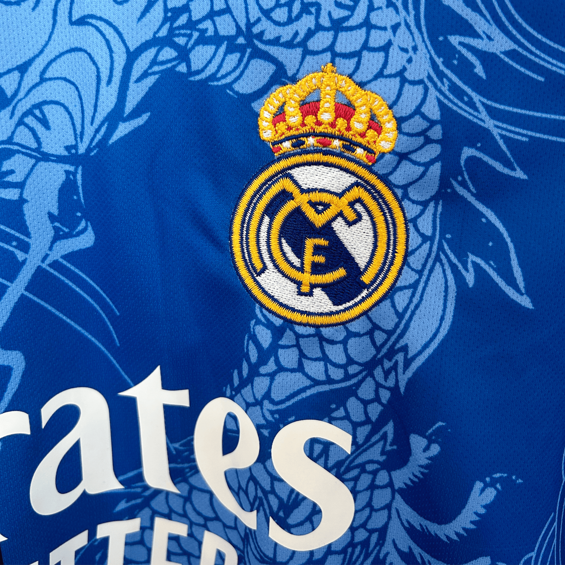 Real Madrid Dragon Blue Noir football kit by ELVN featuring the team logo and blue and black design elements.