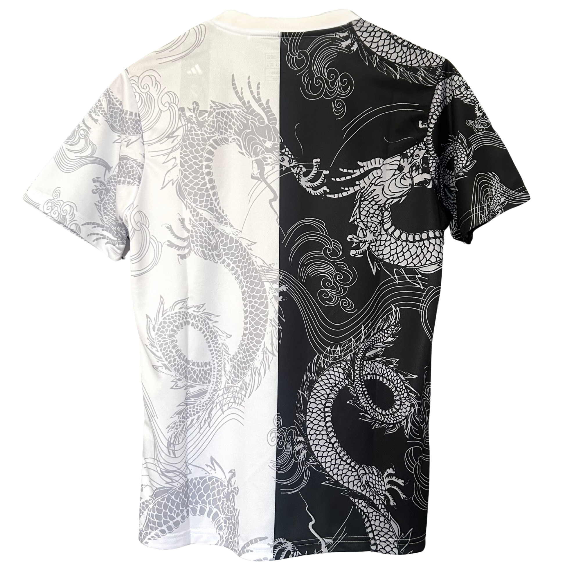 Real Madrid dragon white and black football kit by ELVN, featuring team crest and detailed design elements on jersey.