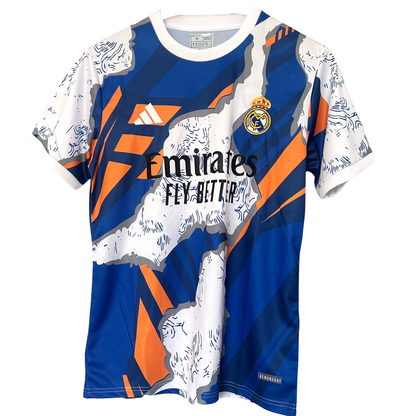 Real Madrid blue and orange soccer kit by ELVN, featuring team crest, jersey with vibrant colors, and matching shorts.