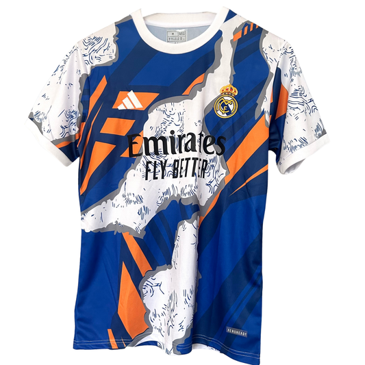 Real Madrid blue and orange soccer kit by ELVN, featuring team crest, jersey with vibrant colors, and matching shorts.