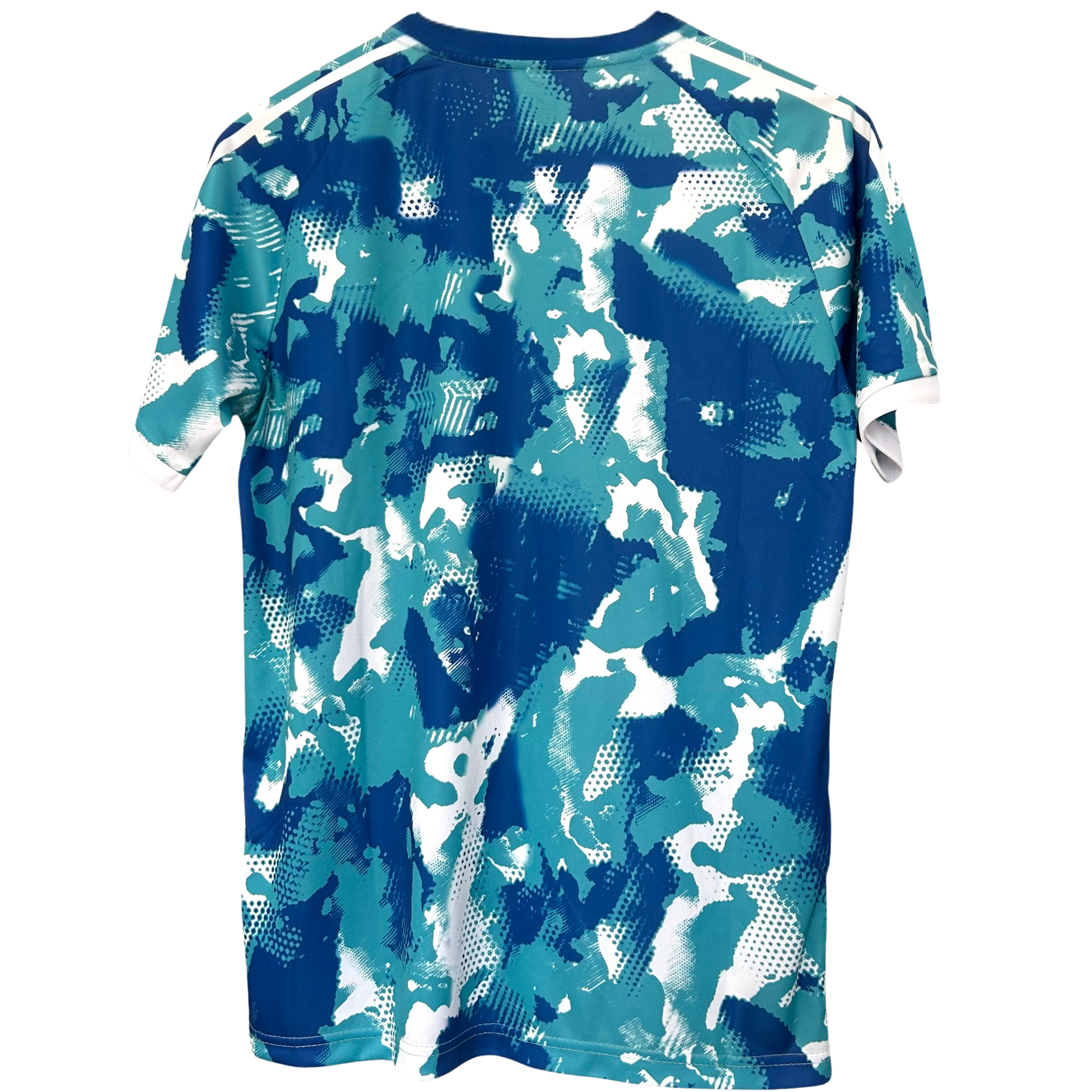 Real Madrid blue and white camouflage football kit by ELVN, featuring team logo and modern design.