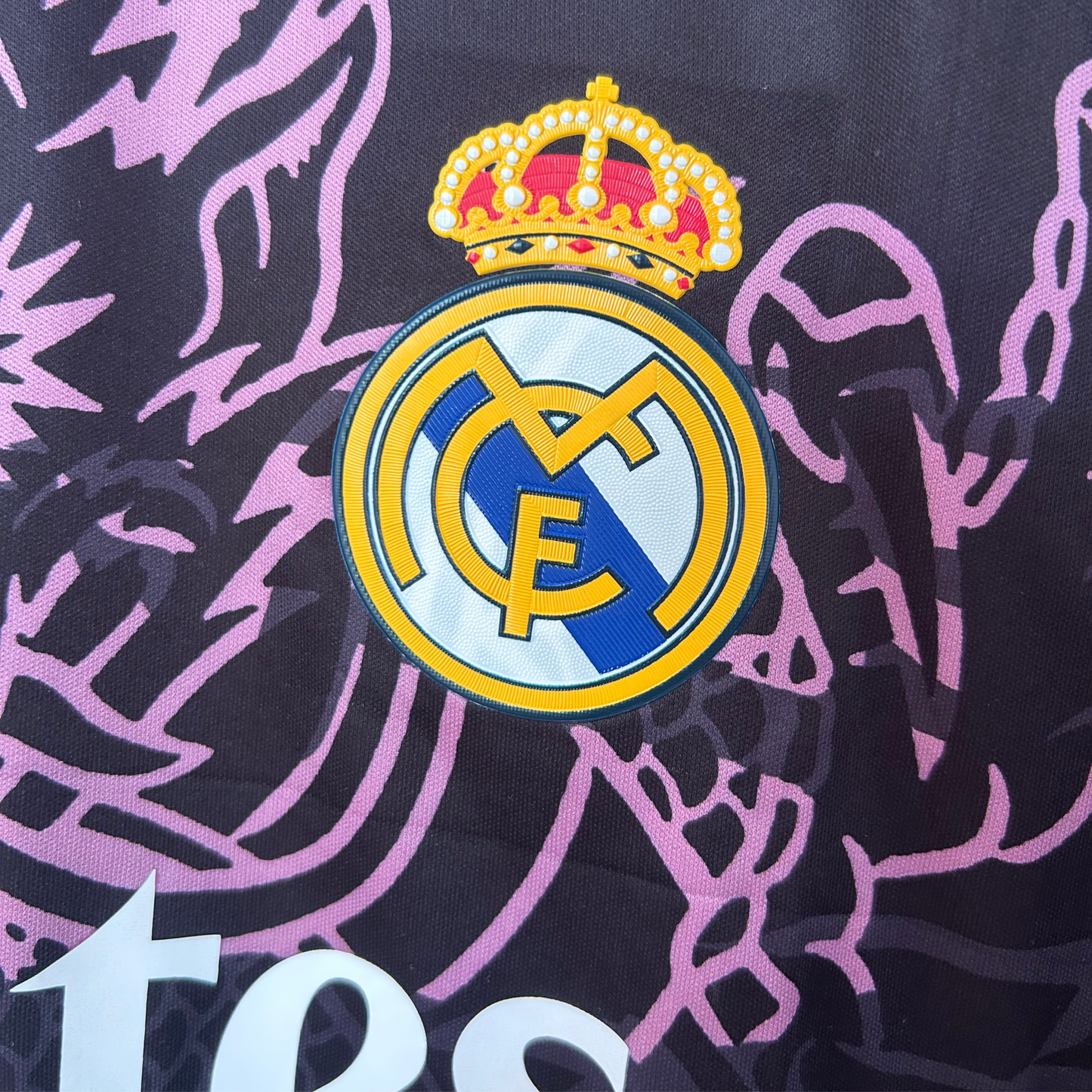 Real Madrid dragon kit by ELVN featuring team logo, vibrant colors, and detailed design on a sports jersey.