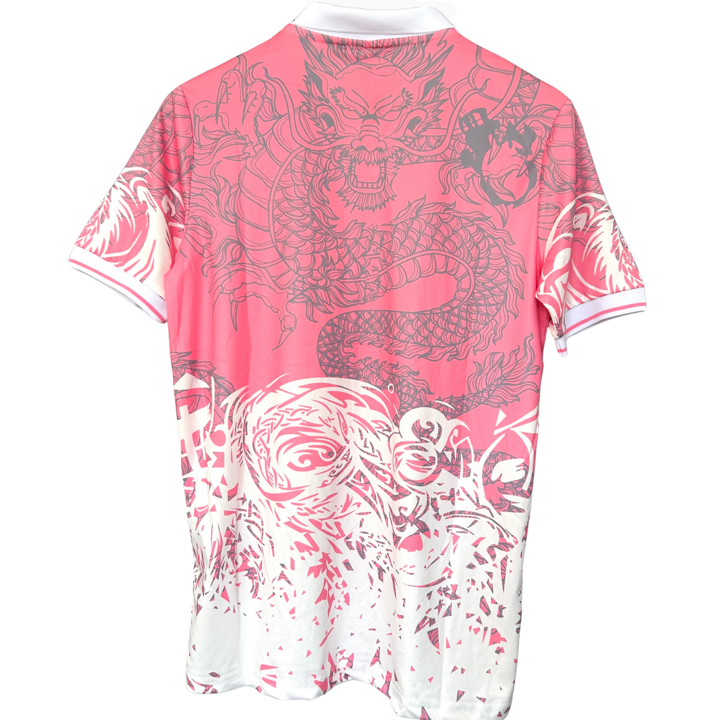 Elvn Real Madrid pink dragon football kit with team crest, designed for fans and players, featuring pink jersey and matching shorts.