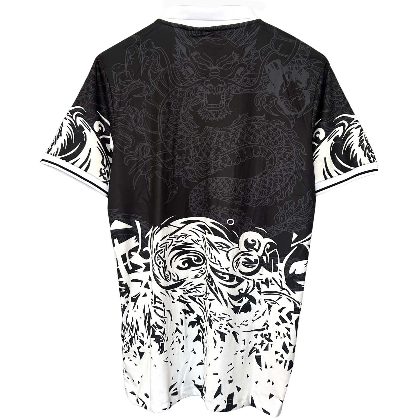 Real Madrid black dragon kit by ELVN, featuring the team jersey with dragon logo design on the front.