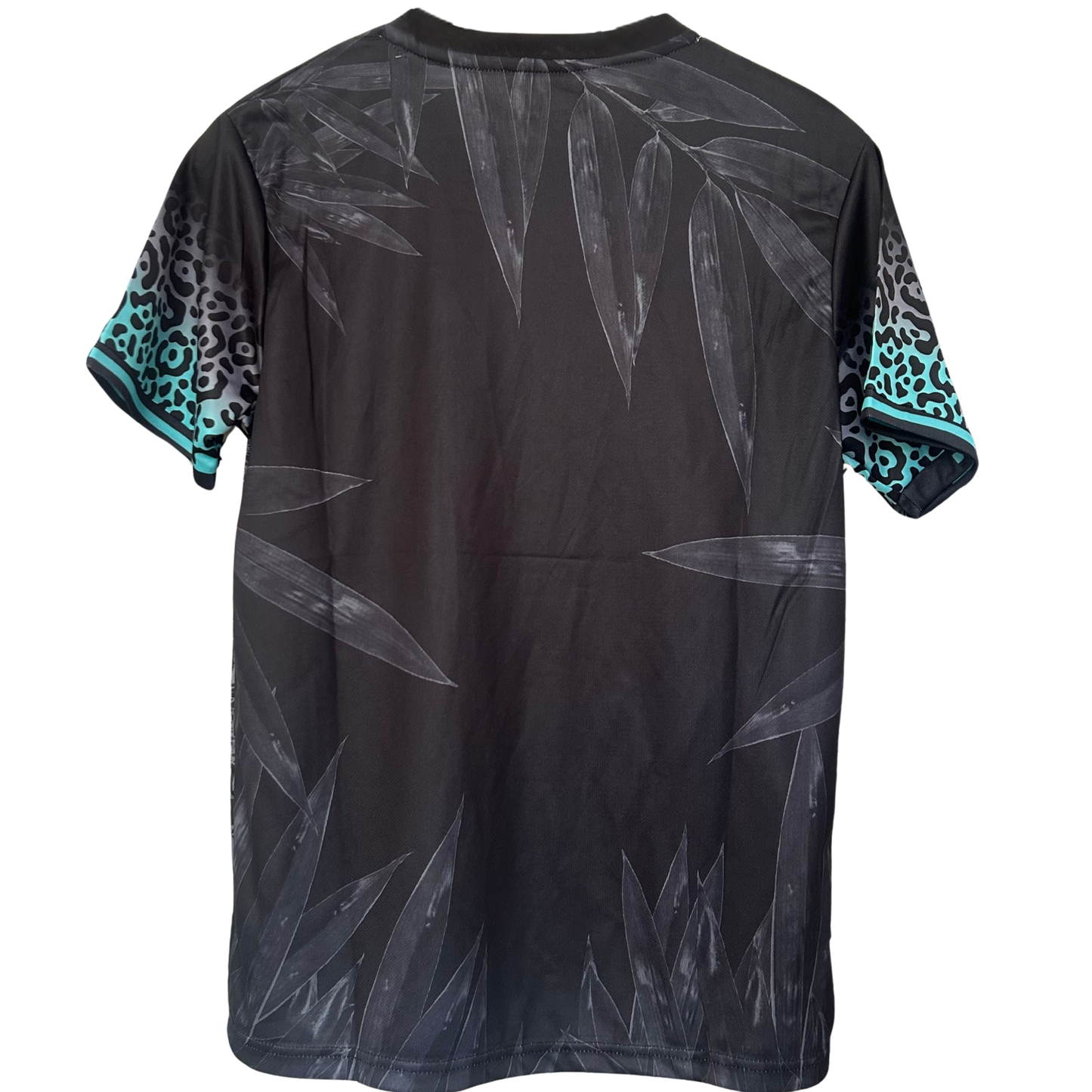 ELVN Brazil Jungle Night Kit featuring vibrant tropical-themed clothing and accessories in green, yellow, and black colors.