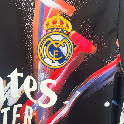 Real Madrid and Louis Vuitton black sports kit by ELVN, featuring team and brand logos on a sleek athletic design.