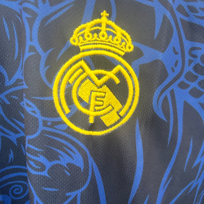 Real Madrid yellow dragon soccer kit by ELVN featuring team jersey with dragon logo and vibrant yellow design.