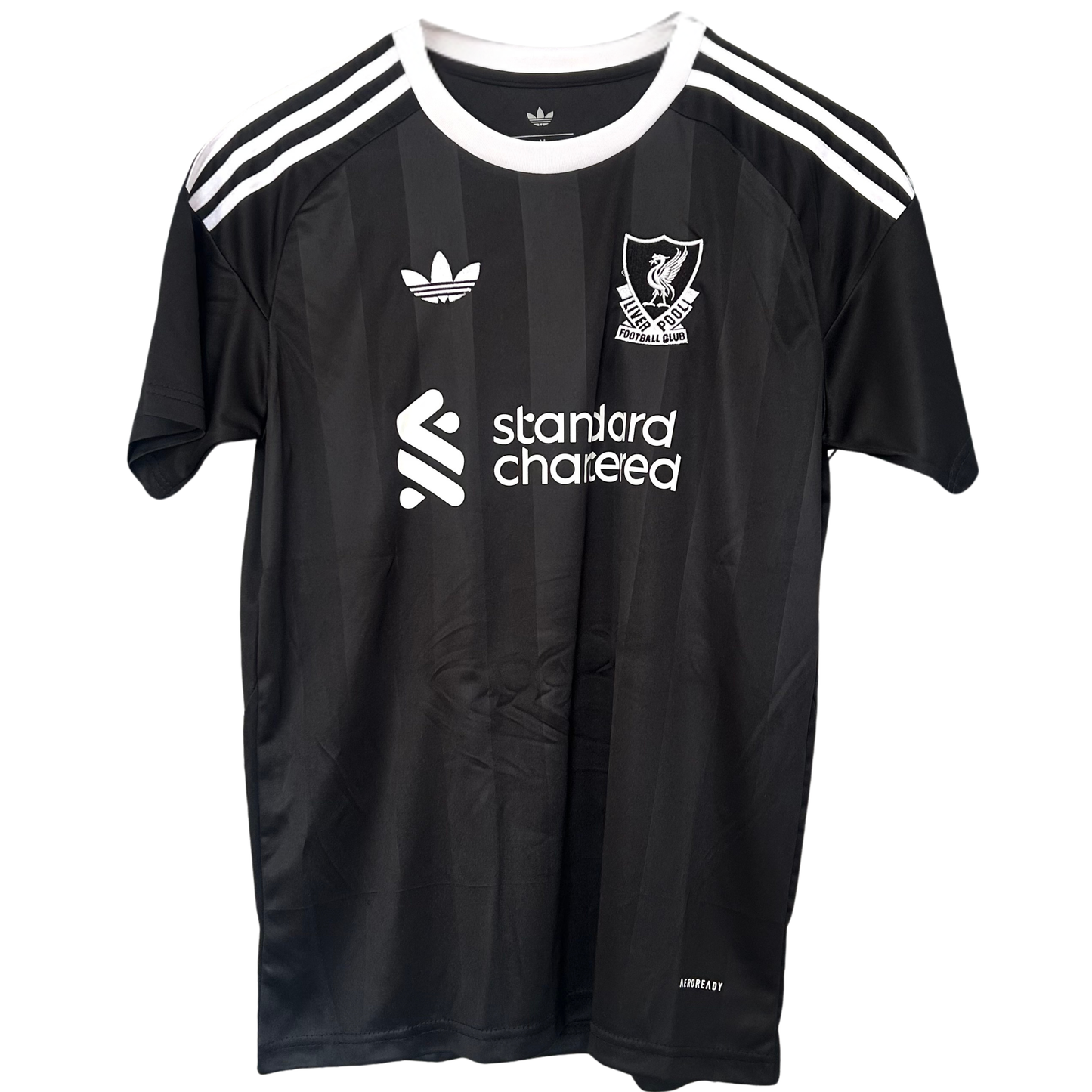 Liverpool third goalkeeper kit 2025/26 by ELVN featuring the team’s logo, vibrant green jersey, and matching shorts.