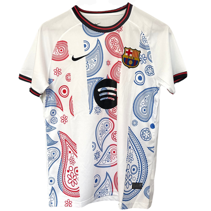 FC Barcelona paisley white kit by ELVN, featuring the team's logo and distinctive paisley pattern on the jersey.