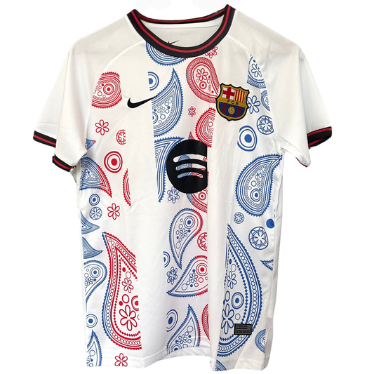 FC Barcelona paisley white kit by ELVN, featuring the team's logo and distinctive paisley pattern on the jersey.