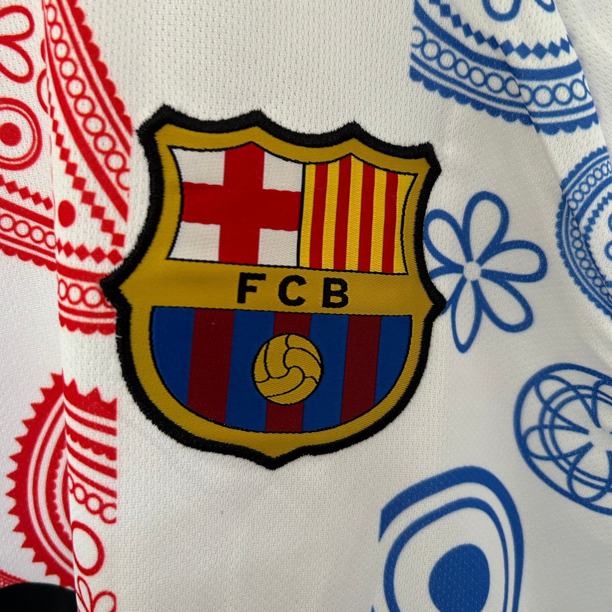 FC Barcelona paisley white kit by ELVN, featuring the team jersey with blue and claret accents and paisley pattern details.