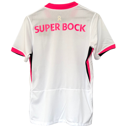 ELVN Sporting CP pink October kit featuring a pink jersey with club crest and sponsor logos, displayed on a hanger.