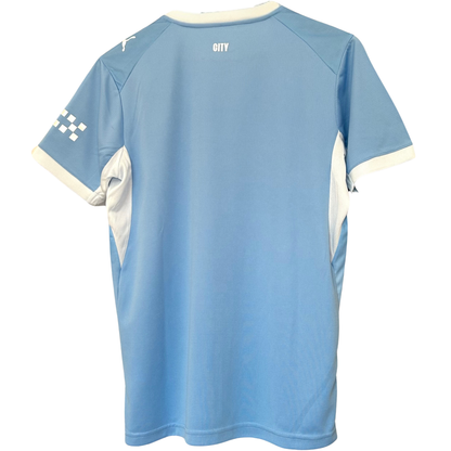 Manchester City home kit 2026/27 by ELVN, featuring the team’s jersey with club crest and modern design details.