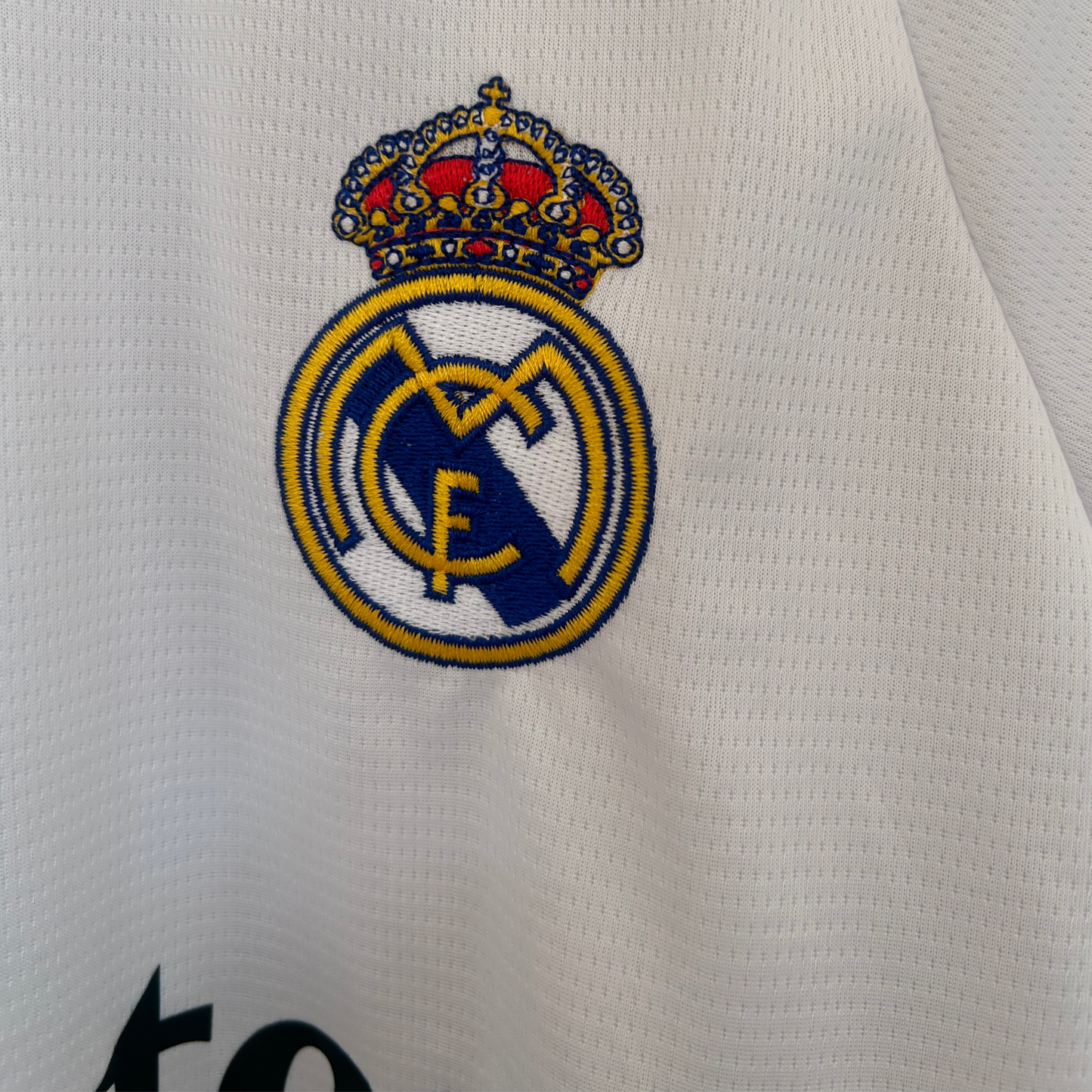 Real Madrid home kit 2026/27 by ELVN featuring white jersey with team crest and modern design elements.