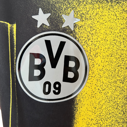 ELVN Borussia Dortmund graphic kit featuring the team logo, black and yellow design, and sports jersey details.