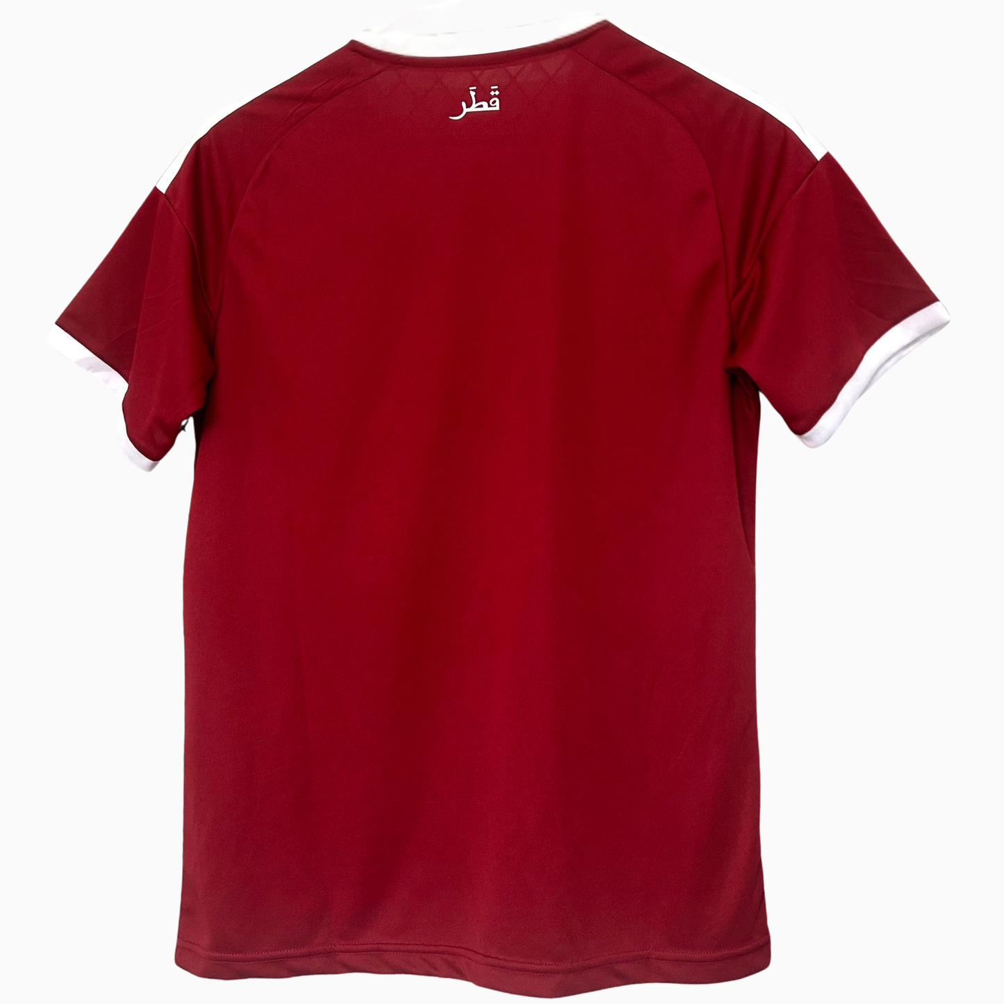 ELVN Qatar home football kit 2026 with team logo, red and maroon jersey, and matching shorts on a white background