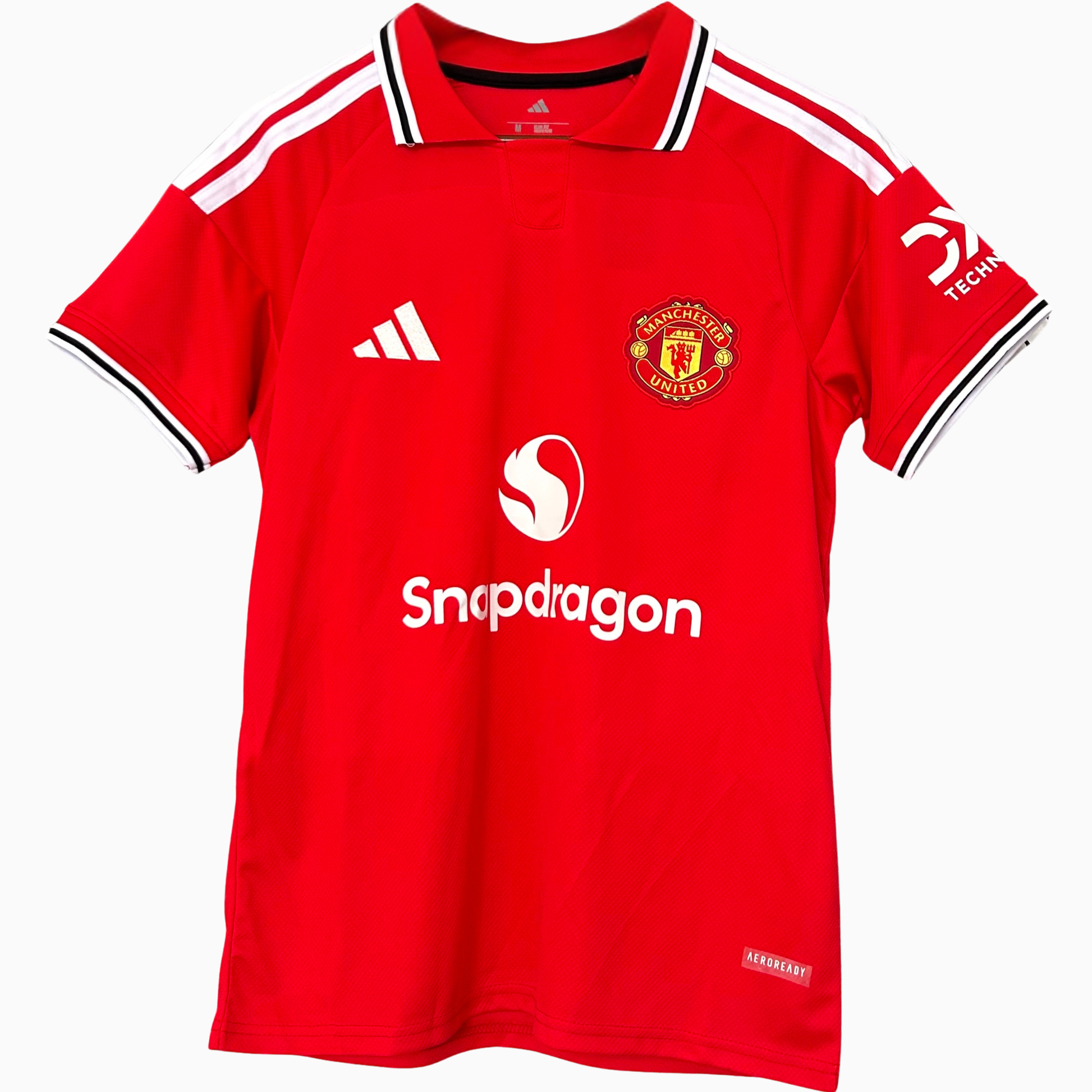 Manchester United home kit 2026/27 by ELVN, featuring red jersey with team crest and matching shorts on a mannequin.