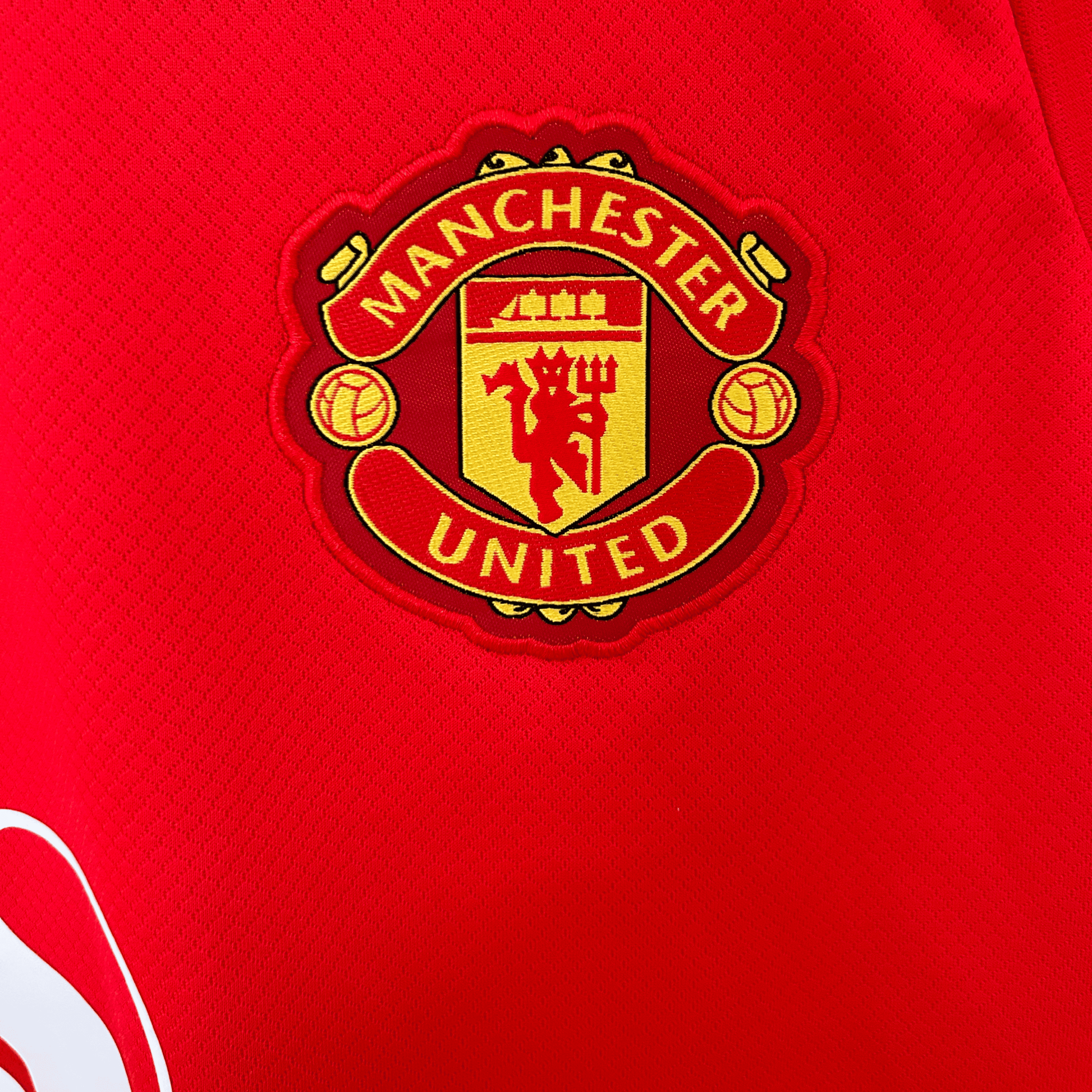 Manchester United home kit 2026/27 by ELVN, featuring the team's red jersey with club crest and matching shorts.