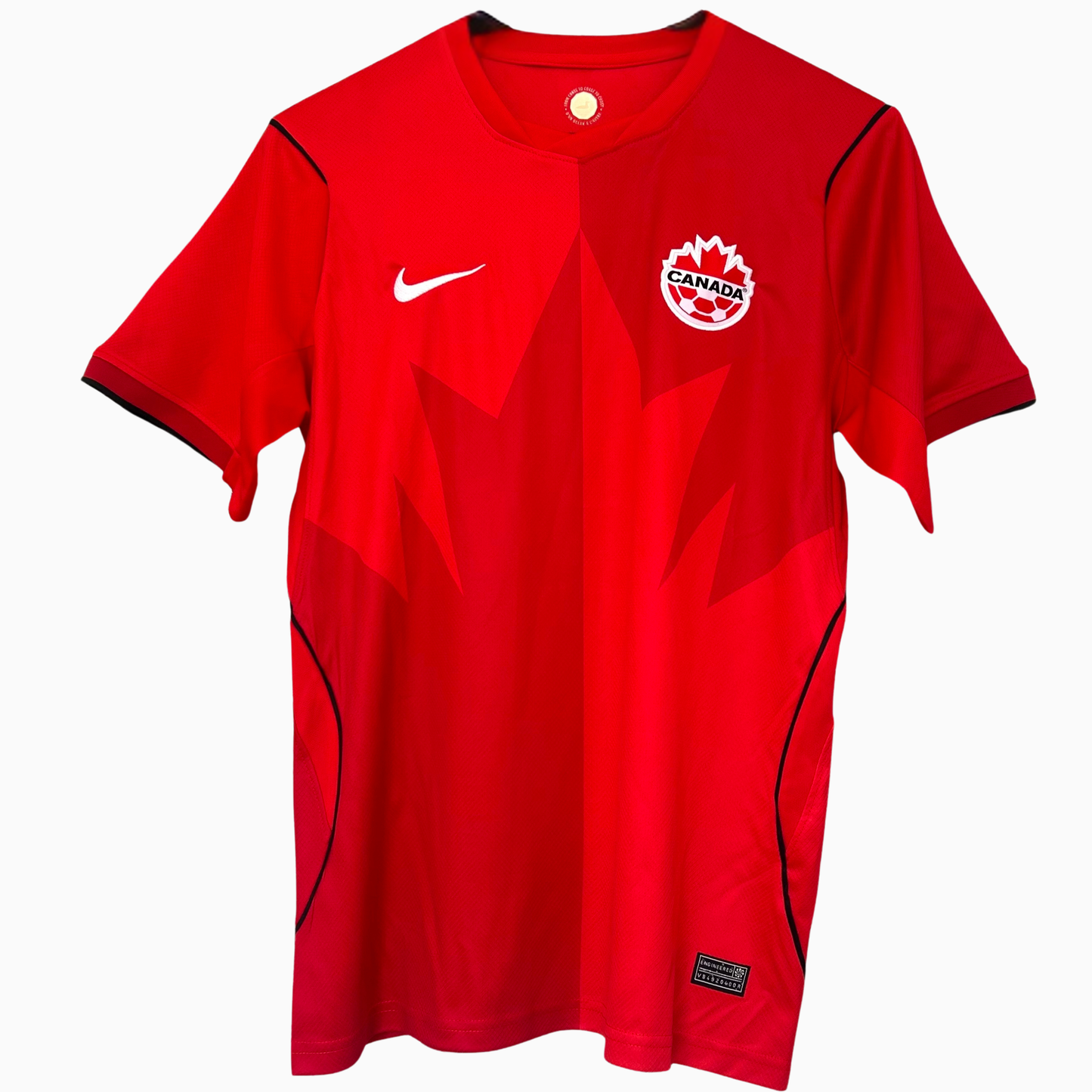Canada Home Kit 2026 by ELVN featuring a red jersey with white accents and team logo, displayed on a plain background.