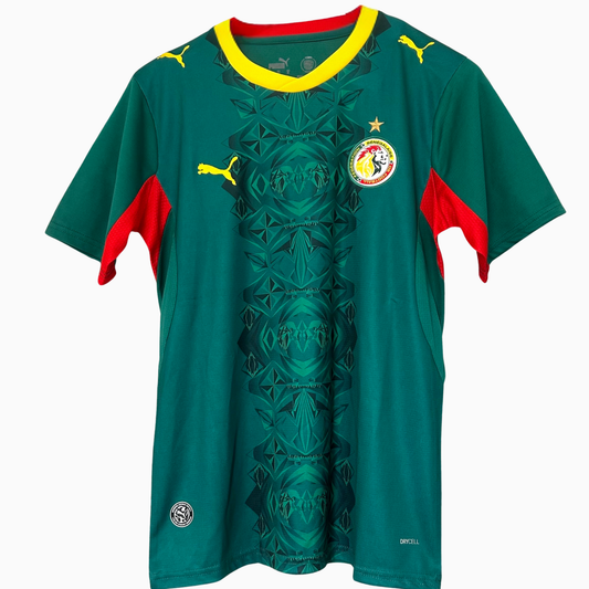 Senegal Away Kit 2026 by ELVN featuring team jersey with green, yellow, and red accents, displayed on a plain background.