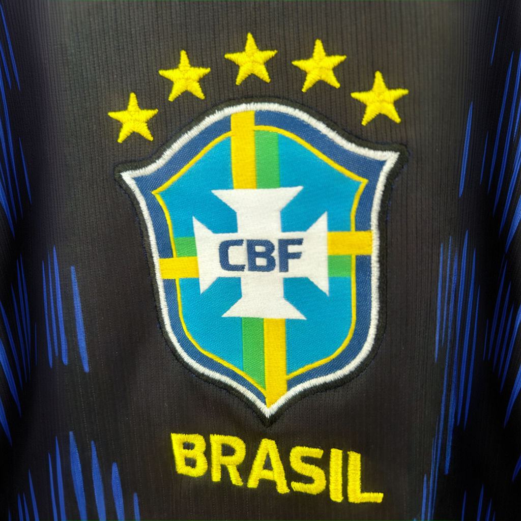 Brazil away soccer kit 2026 by ELVN featuring blue jersey with yellow accents and team logo, displayed on mannequin.