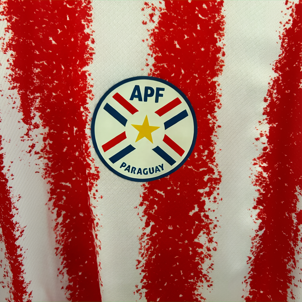 Elvn Paraguay home football kit 2026 with team jersey, shorts, and socks in red, white, and blue colors, displayed on a plain background.