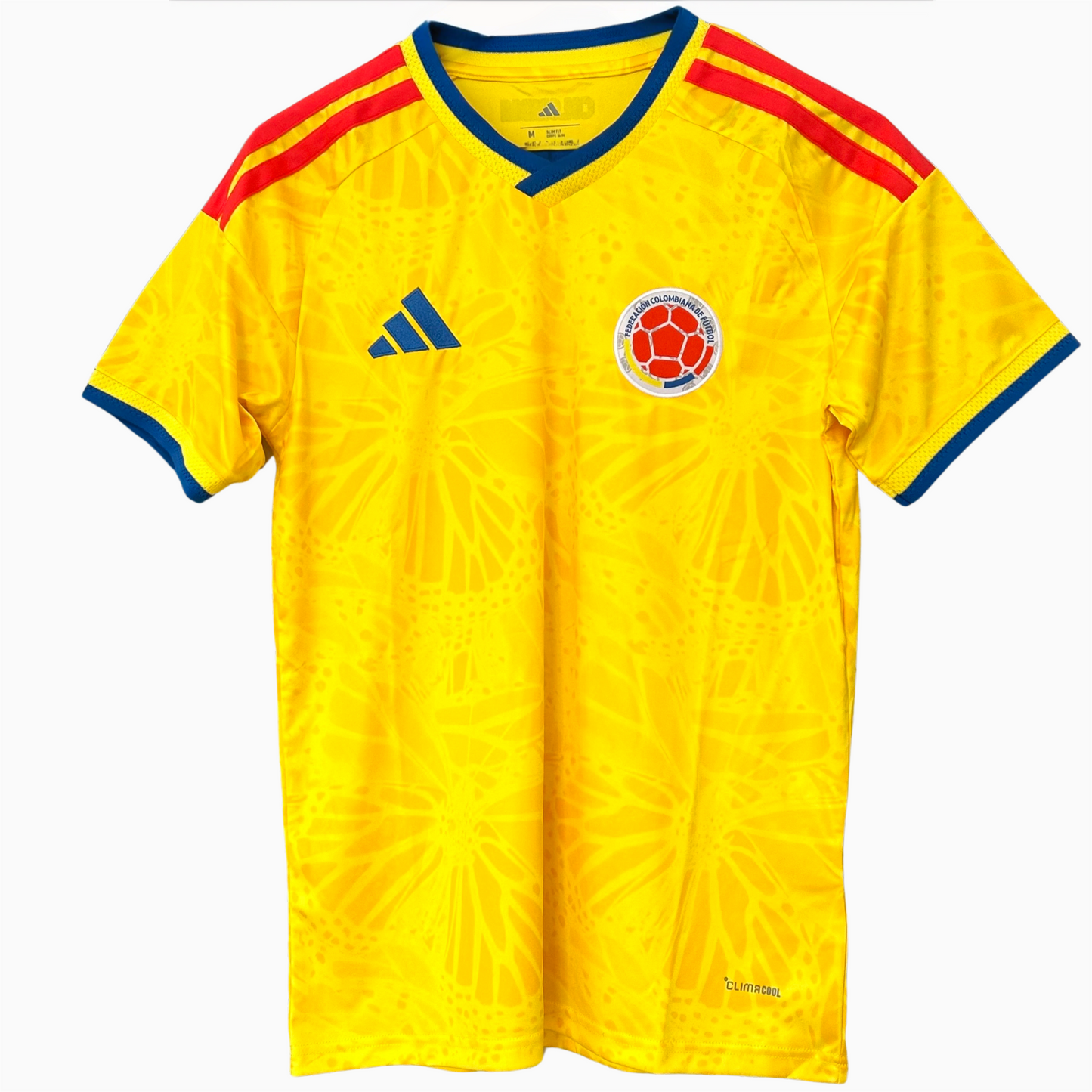 Colombia national football team home kit 2026 by ELVN, featuring blue jersey, white shorts, and team logo on the chest.