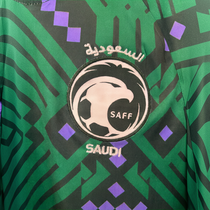 Saudi Arabia home kit 2026 soccer jersey by ELVN, featuring team crest and green and white design, displayed on a hanger.