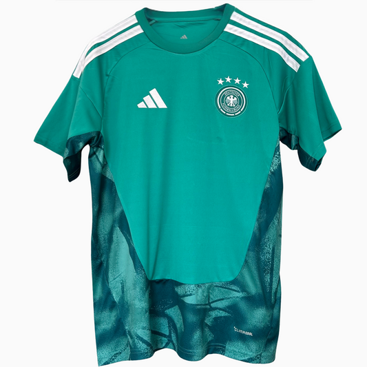 Germany goalkeeper kit 2026 by ELVN featuring a green jersey, shorts, and goalkeeper gloves on a mannequin.