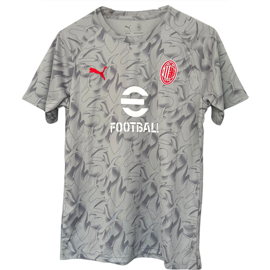 AC Milan pre-match kit 2025/26 by ELVN, featuring the team jersey and shorts with club crest and design details.