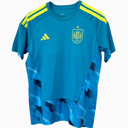 Spain goalkeeper kit 2026 by ELVN, featuring a green jersey, shorts, and goalkeeper gloves, designed for football matches.