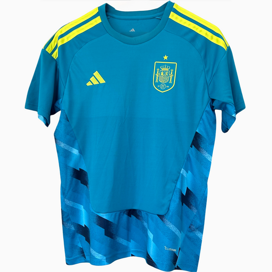 Spain goalkeeper kit 2026 by ELVN, featuring a green jersey, shorts, and goalkeeper gloves, designed for football matches.