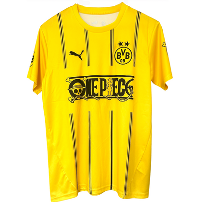 Elvn Borussia Dortmund X One Piece kit featuring team jersey with logo and colorful design, displayed on a flat surface.