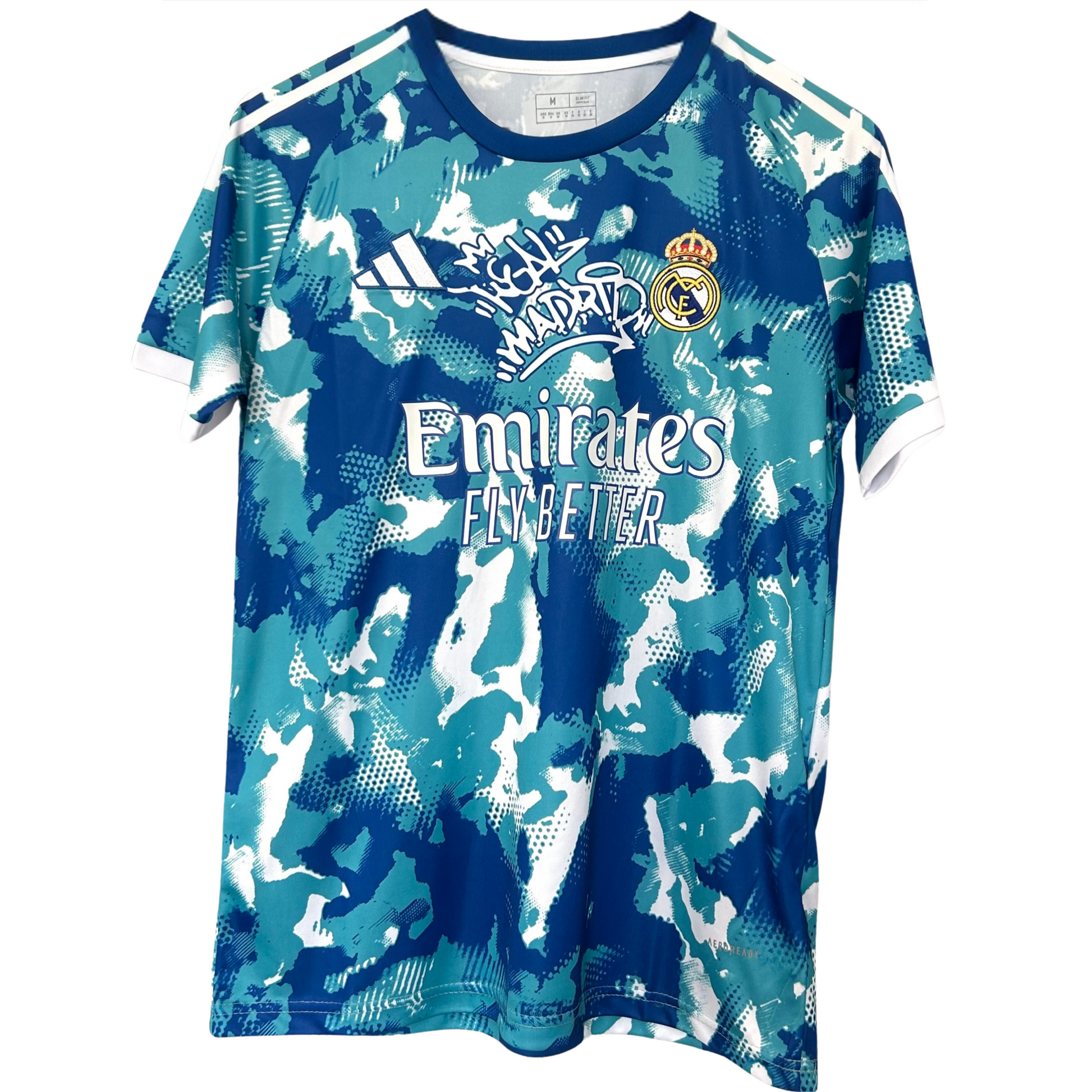 Real Madrid blue and white camouflage kit by ELVN, featuring the team jersey with distinctive camo pattern and team logo.